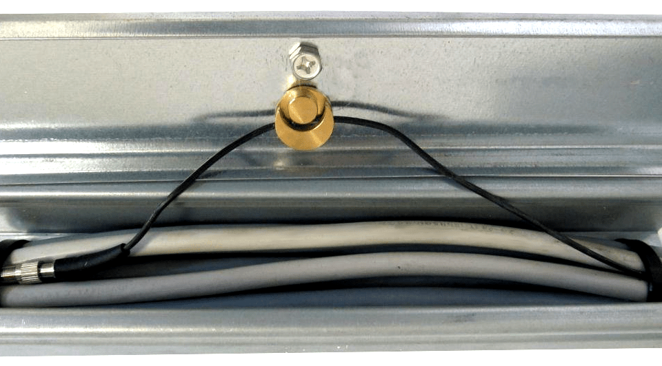 LiteWIRE attached to the cover of a cable tray using a fast bolt